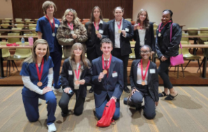 Group photo of students with medals involved in HOSA at CFHS